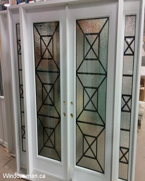 Double exterior doors and two sidelights. White. Modern design. Towns bridge wrought iron glass inserts
